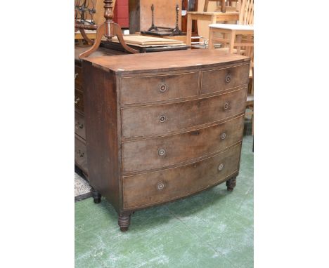 A Victorian mahogany caddy topped bowfront chest of drawers, two short cockbeaded drawers over three graduated long, turned f