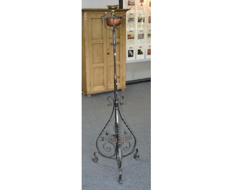 A Vintage decorative wrought iron and brass telescopic oil standard lamp converted to electric.