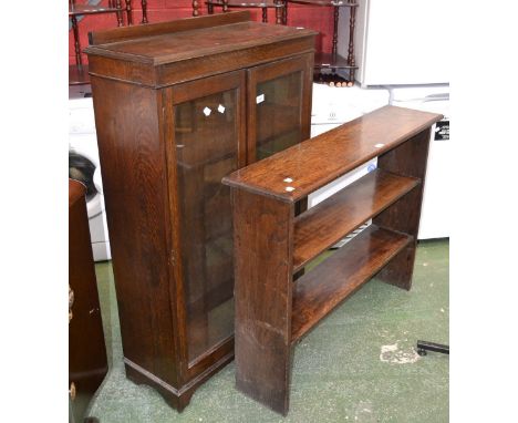 A George V oak two door glazed bookcase; an oak three tier book shelf 