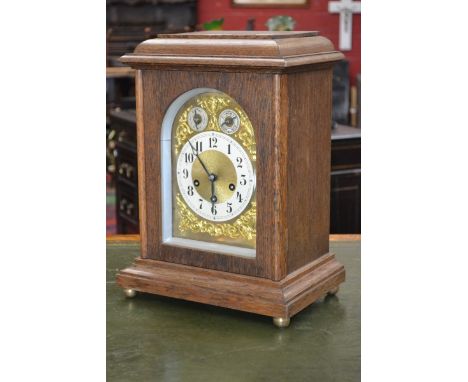 A large oak cased Junghans Biz mantel clock, three winding holes, chime/silent and slow/fast subsidiary dials