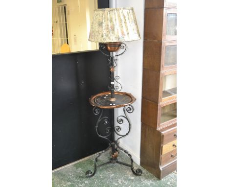 A 20th century wrought iron and copper standard lamp, converted from oil to electricity