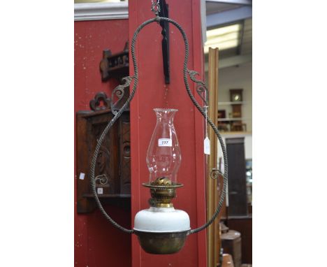 A Victorian brass framed hanging oil lamp