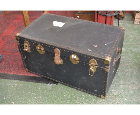 A two handled travelling trunk, hinged cover, Cunard Line paper label