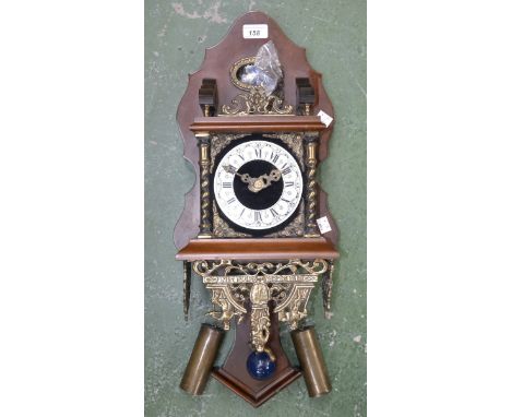 A 20th century Dutch gilt metal mounted wall clock, figural cresting
