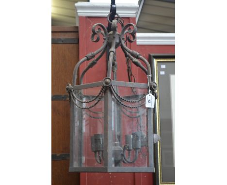 A large painted copper hexagonal ceiling lantern with bevelled panels
