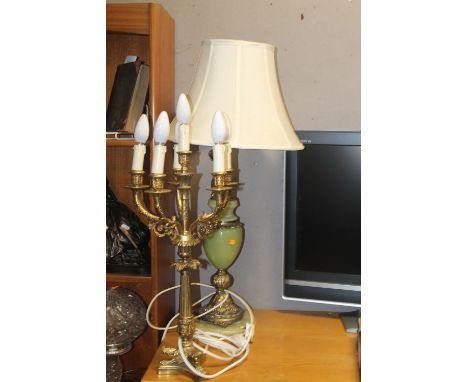 AN ONYX TABLE LAMP TOGETHER WITH A BRASS LAMP