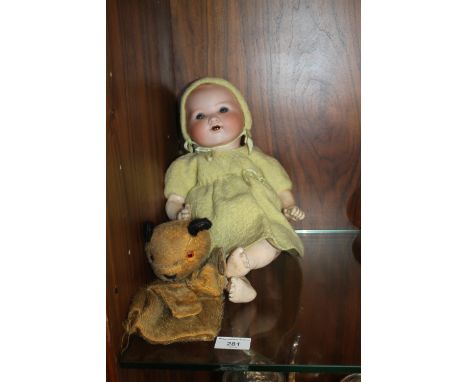 AN ARMAND MARSEILLE PORCELAIN HEADED  DOLL TOGETHER WITH A SOOTY HAND PUPPET