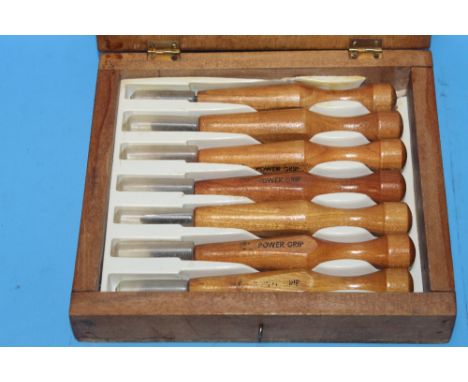 A CASED 7 PIECE SET OF POWER GRIP WOODCARVING TOOLS