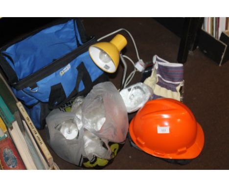 A SMALL ANGLE POISED LAMP, A HARD HAT, KNEEPADS ETC.