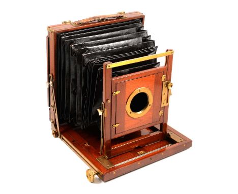 Vintage mahogany and brass plate camera, unused plates, etc. in a leather case, an oak folding tripod.Condition report:The di