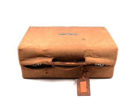 Vintage leather travelling case, canvas outer cover, interior fitted with silver mounted bottles and jars, marks worn.Conditi