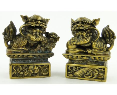 A pair of Chinese bronze dogs of fo, 
height 8".