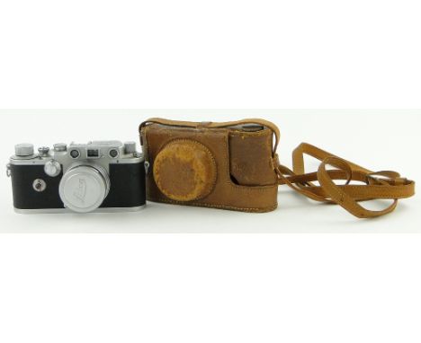 A Vintage Leitz Leica camera no. 380904, 
leather cased.