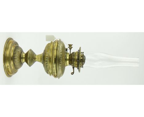 A Victorian fluted brass oil lamp
with chimney, height 21".