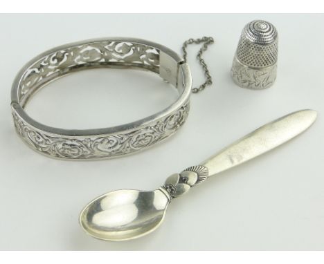 Silver hinged bangle, small Danish silver spoon and a silver thimble, (3).
