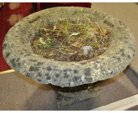 A weathered stoneware garden planter on stand,
width 2'8, height 1'8.
