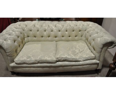 A Victorian button upholstered roll arm Chesterfield sofa,
width 6', depth 3'.