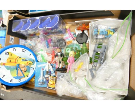 A mixed collection of Thunderbirds items including: figures, egg cup set, clock etc 