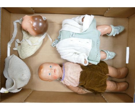 Large ceramic headed doll: together with similar damaged items 