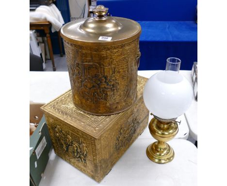 A collection of brass items to include: slipper box, coal bucket and oil lamp 
