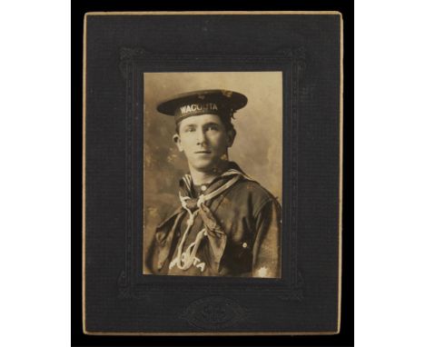 Gelatin silver print photograph mounted to board depicting a crew member of James J. Hill's steam ship "Wacouta." Printed by 