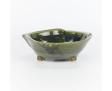 Warren MacKenzie (American, 1924-2018). Tripod bowl of irregular form. High-fired stoneware with copper green oribe style gla