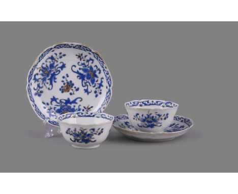 A pair of Chinese porcelain blue enamel decorated hexagonal lobed tea bowls and saucers, Yongzheng, 1723-1735, painted with t