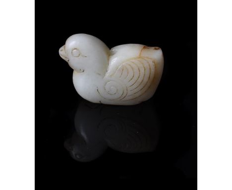 A Chinese white jade 'Mandarin duck' pendant, Ming Dynasty, details carved in low relief and drilled to the back of the duck,