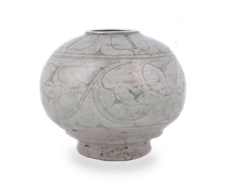 A Korean Pottery Punch'ong Vase, of globular form raised on a thick, slightly splayed foot rim, heavily carved and incised wi