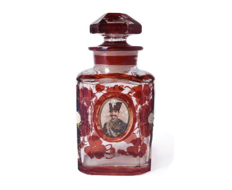 An Islamic market ruby flash scent bottle and stopper, 19th century, probably depicting Naser al Din Shah Qajar, 14.5cm high 