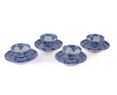 Four Chinese blue and white 'crab and fish' tea bowls and saucers, Qing Dynasty, 19th century, the four lobed tea bowls and s