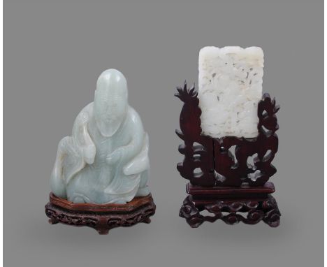 A Chinese celadon jade carving of an immortal, 19th/early 20th century, the god of longevity is carved seated on the back of 
