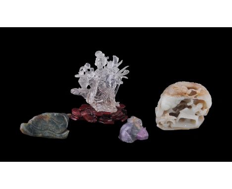 A Chinese rock crystal carving of a seated Lady, probably Republic, 12.5cm high, wood stand; a jade carving of a bird on a lo