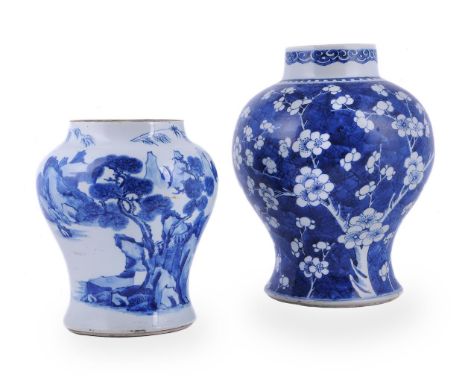 A Chinese blue and white baluster vase, Kangxi, decorated with branches of prunus blossom against a 'cracked-ice' ground, 32c