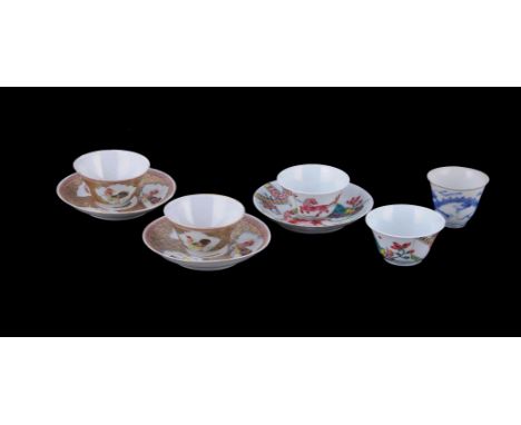 A pair of Chinese Famille Rose 'Cockerel' tea bowls and saucers, Yongzheng, each painted with three leaf-shaped panels enclos