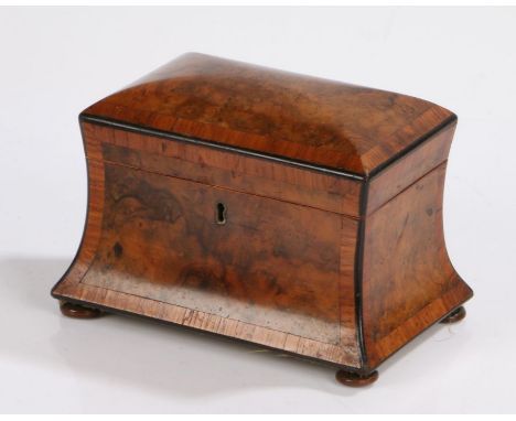 Victorian walnut tea caddy, the domed cover above a waisted body, the interior with two lidded compartments, raised on squat 