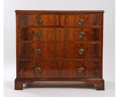 Victorian mahogany chest of two short and three long drawers, the handles with embossed oval backplates, raised on bracket fe