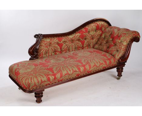 Victorian mahogany chaise lounge, the arched top rail above a button back and stuff over seat raised on turned legs and casto
