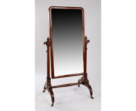 Victorian mahogany cheval mirror, the arched mirror plate held between acorn capped turned columns and arched supports united