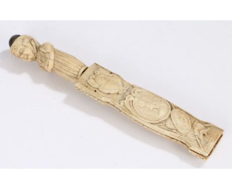 17th Century bone dagger, the figural carved handle above a steel blade, the scabbard with carved profile busts, masks, shiel