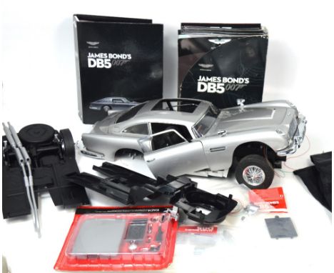 A James Bond 007 'Goldfinger' partially complete Aston Martin DB5 Metal sports car model kit, 1:8 scale, with parts to finish