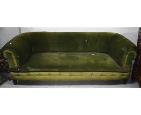An early 20th century roll back sofa upholstered in forest green velvet on bracket feet, length 188cm.
