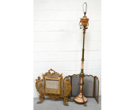A brass and pink ground ceramic standard lamp on three outstretched paw feet, height approx 175cm (af), an ornate gilt metal 