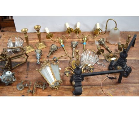 Two iron and brass hand irons, various brass wall lights to include two vintage examples with mirror backs and cut glass drop