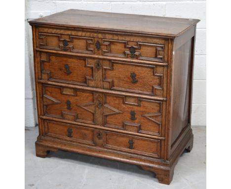 A late 18th early 19th century oak four drawer chest of drawers on bracket feet, width 98cm.