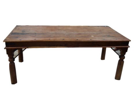 A pine rectangular kitchen table on turned legs with metal bracket supports, length 192cm.