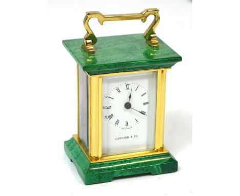 A small reproduction Garrard & Co seventeen jewel carriage clock, the dial set with Roman numerals, height 8cm. CONDITION REP