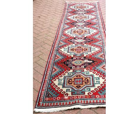 A vintage Caucasian runner, 344 x 85cm.