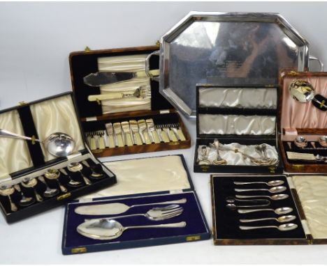 A silver plated twin handled tray presented as a silver wedding present with inscription and a quantity of cased plated flatw