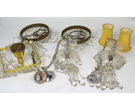 A quantity of cut glass and gilt metal light fittings, some with prism style drops.